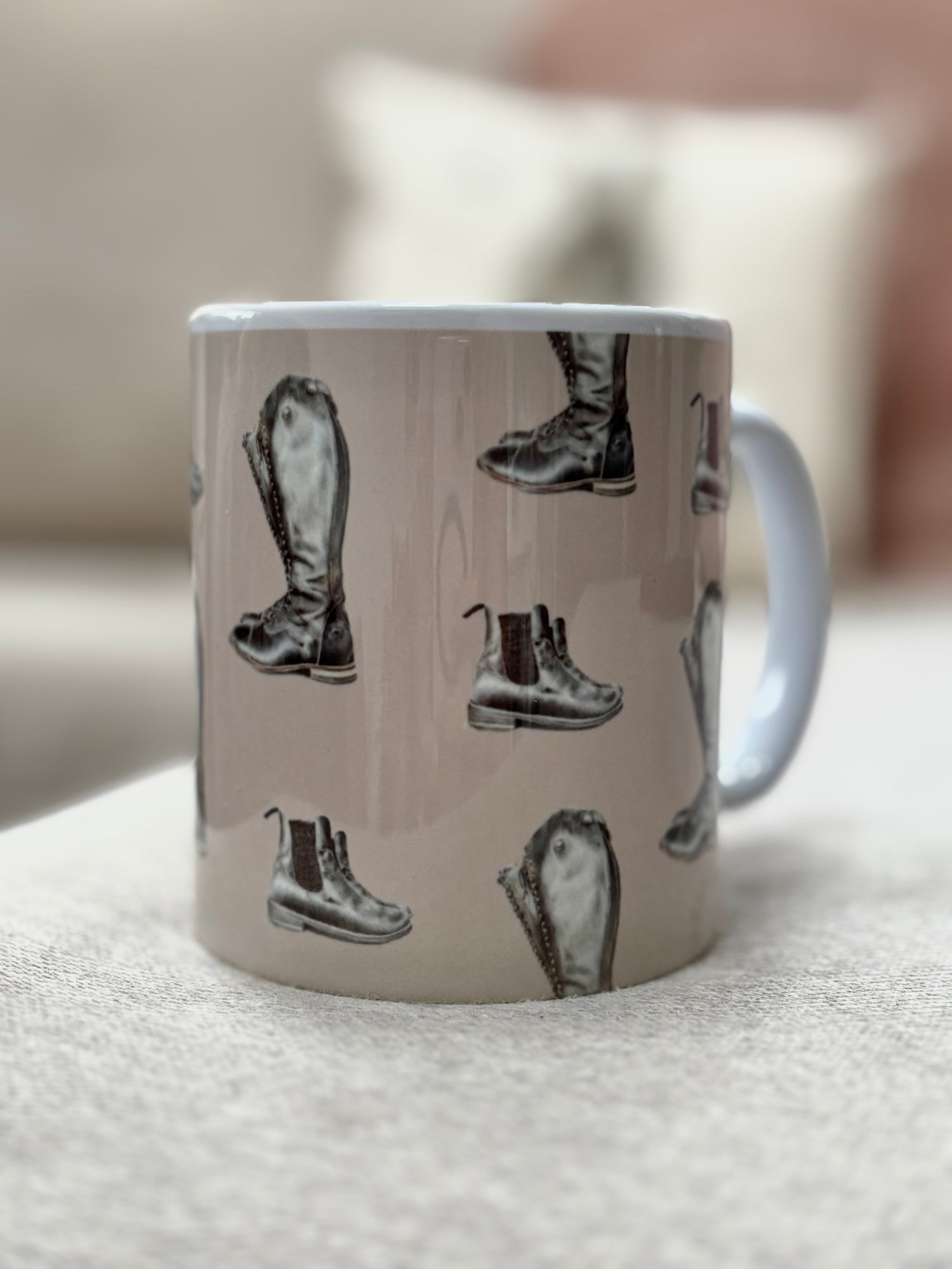 Riding Boot Mug with hand-drawn equestrian boots on beige background. Ideal country kitchen gift for horse lovers and coffee enthusiasts.