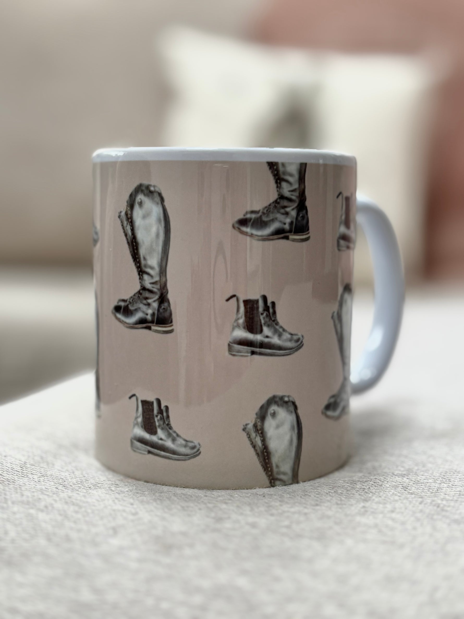 Riding Boot Mug with hand-drawn equestrian boots on beige background. Ideal country kitchen gift for horse lovers and coffee enthusiasts.