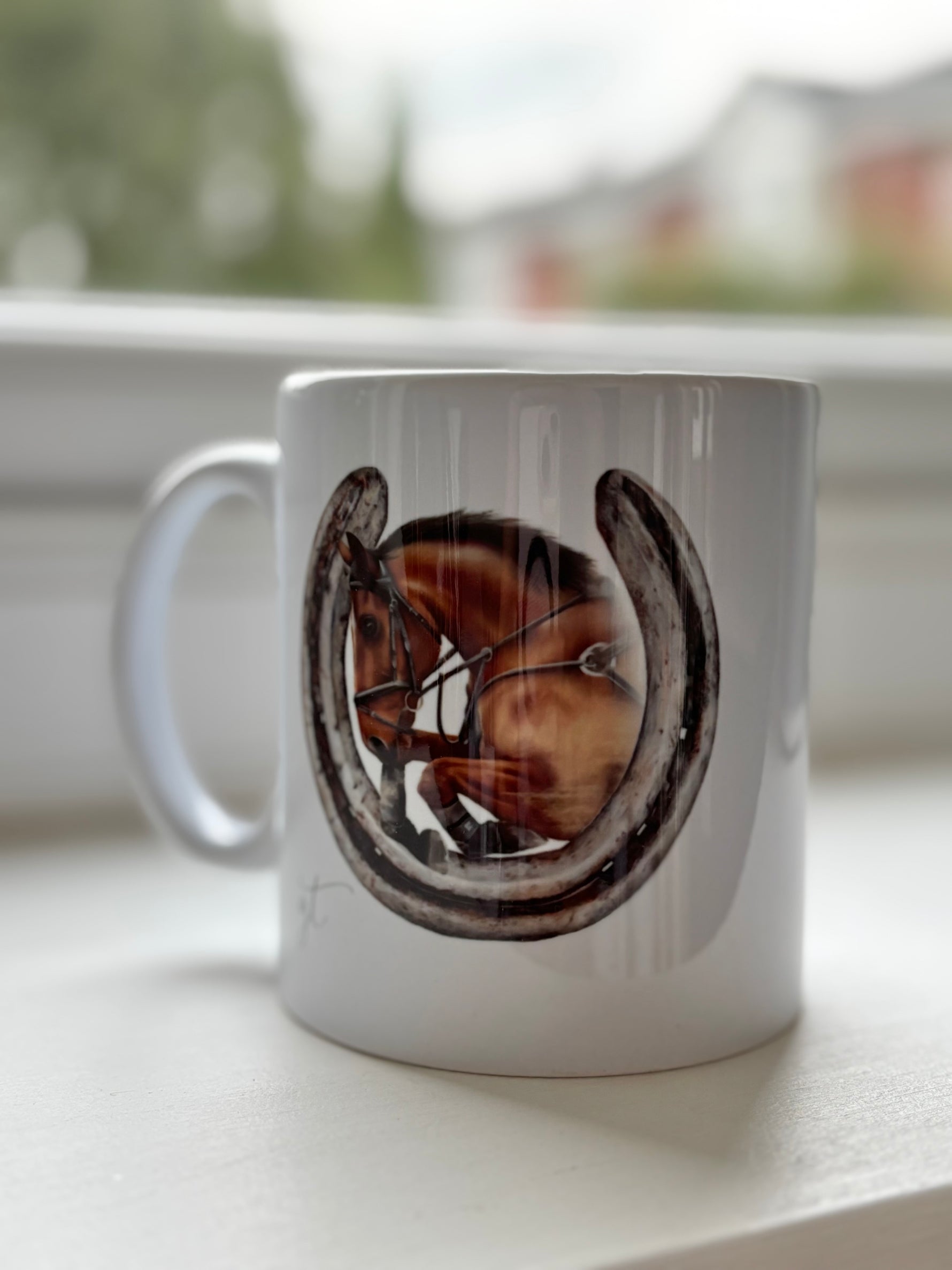 Horse Mug with hand-drawn showjumping horse inside a horseshoe design. Country kitchenware gift for horse lovers, ideal for coffee or tea.