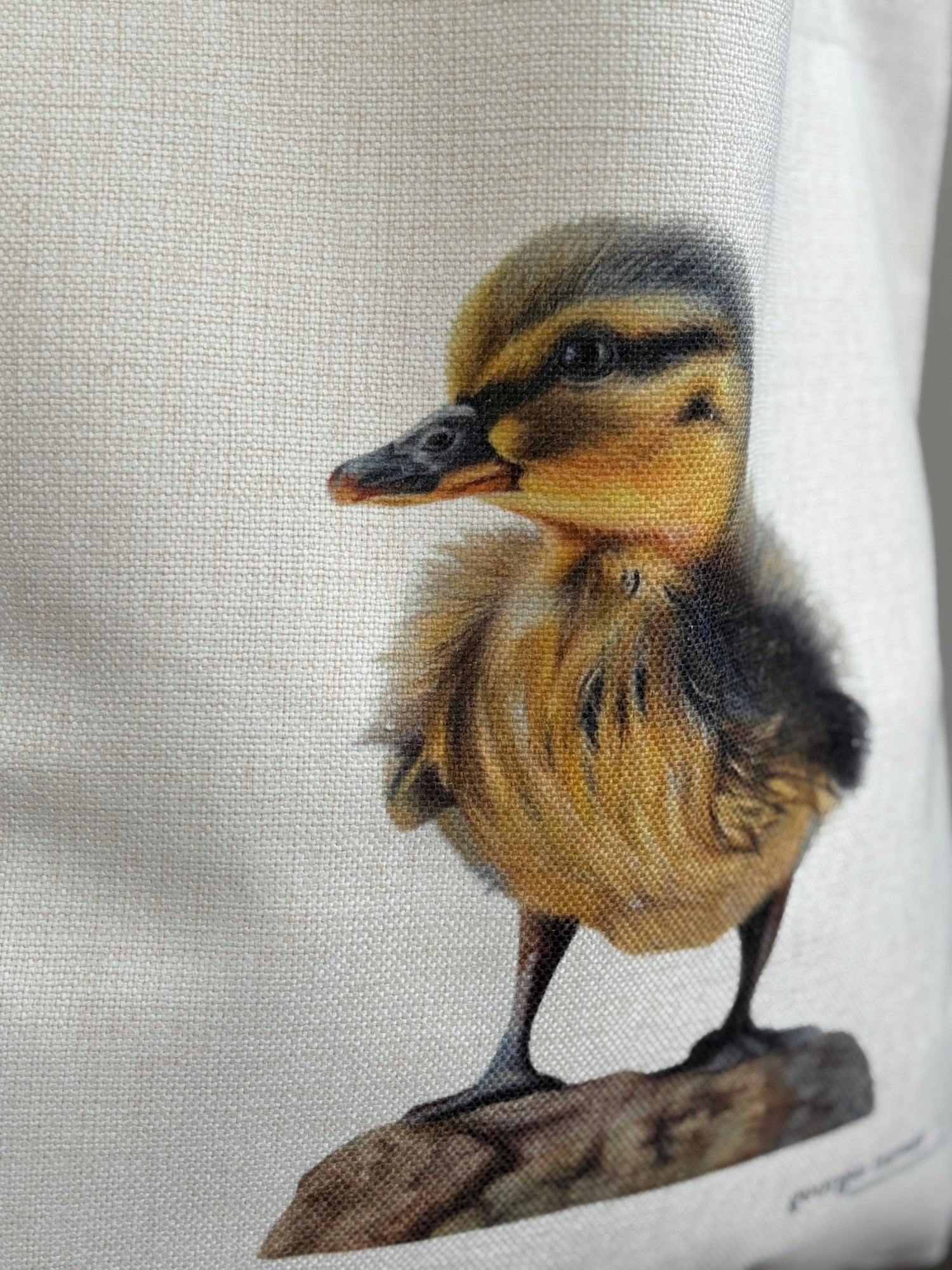 Close-up of duckling artwork on eco-friendly linen tote bag. Reusable and machine washable, perfect gift for wildlife lovers.