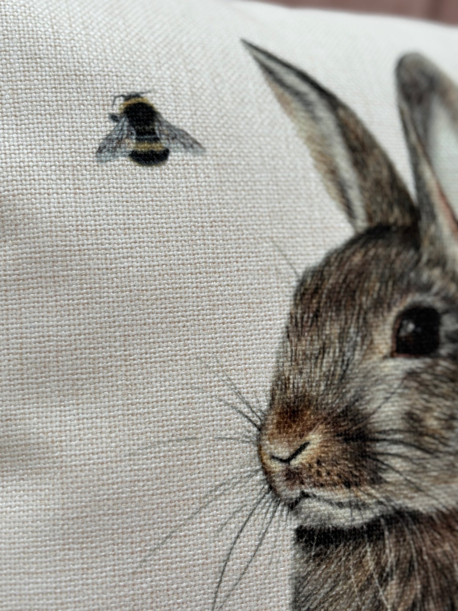Close-up of Rabbit Custom Cushion showing detailed rabbit and bee artwork, ideal for equestrian and country-style home accessories.