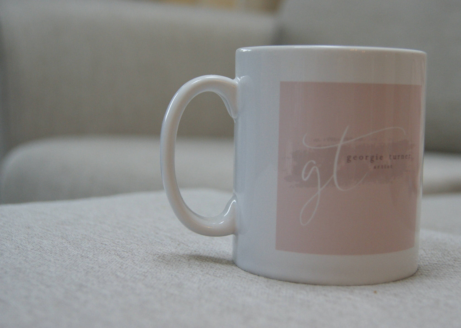 Back of Dog Mug showing pink logo design with 'gt georgie turner, artist'. Stylish drinkware for animal lovers and kitchen decor.