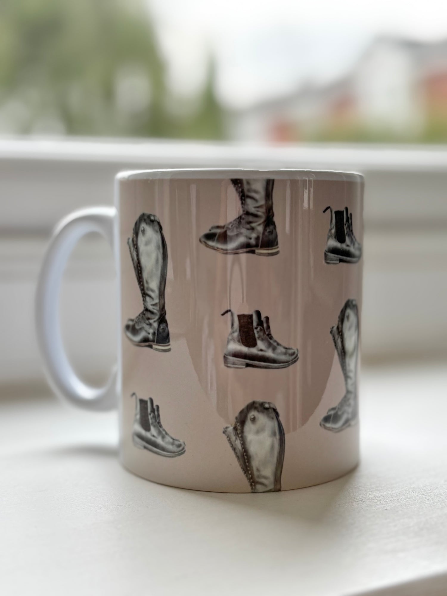 Country kitchen Riding Boot Mug featuring illustrated riding boots. Perfect horse lover gift and rustic coffee mug decor.