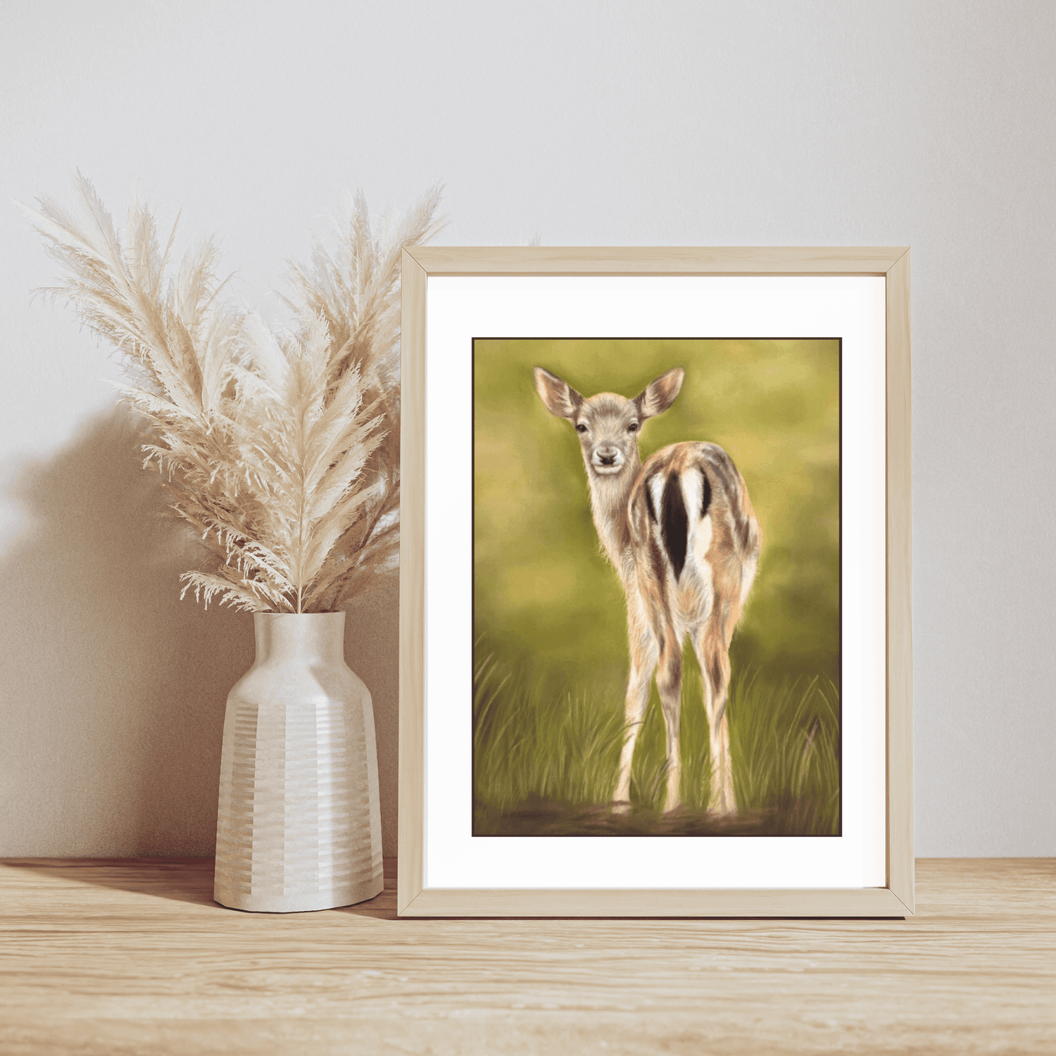 Fallow Fawn Fine Art Print On Paper displayed in a light wooden frame beside pampas grass, perfect for rustic country home interiors.