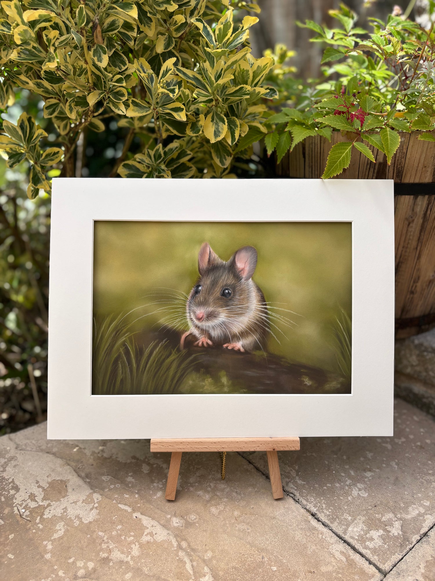 Field Mouse original painting displayed on a mini easel outdoors, showcasing detailed wildlife art perfect for rustic or country-themed interiors.