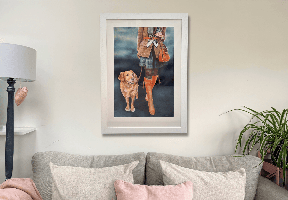 Large framed Game Fair Original Artwork displayed in a cozy living room, showcasing equestrian country style with a dog and fashionable outfit.