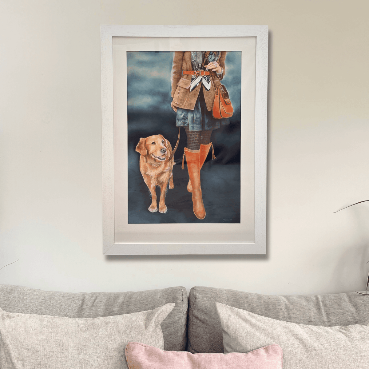Game Fair Original Artwork - Country Home Decor | Large Wall Art featuring a stylish woman in country attire with a golden retriever, framed and hung above a sofa.