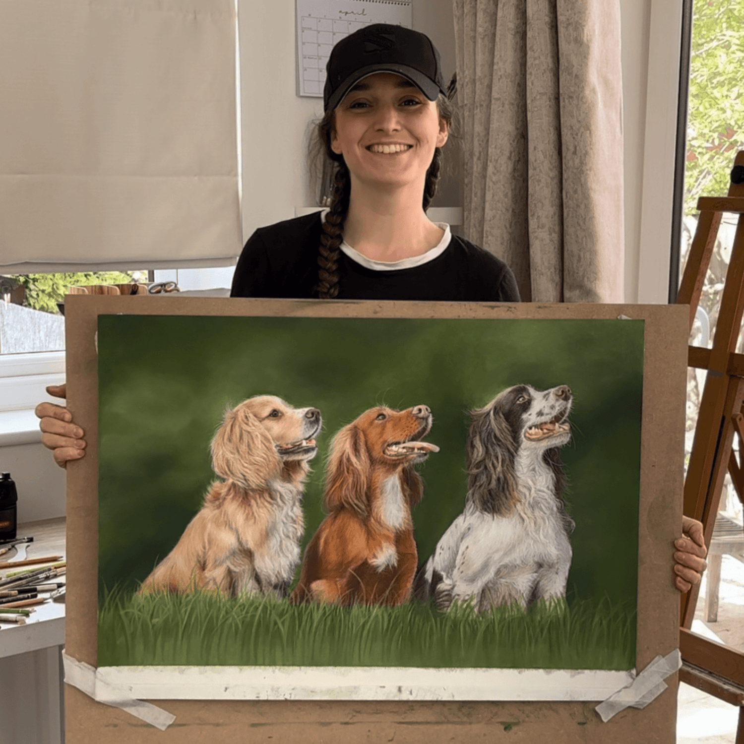 Georgie holding pastel gun dog artwork