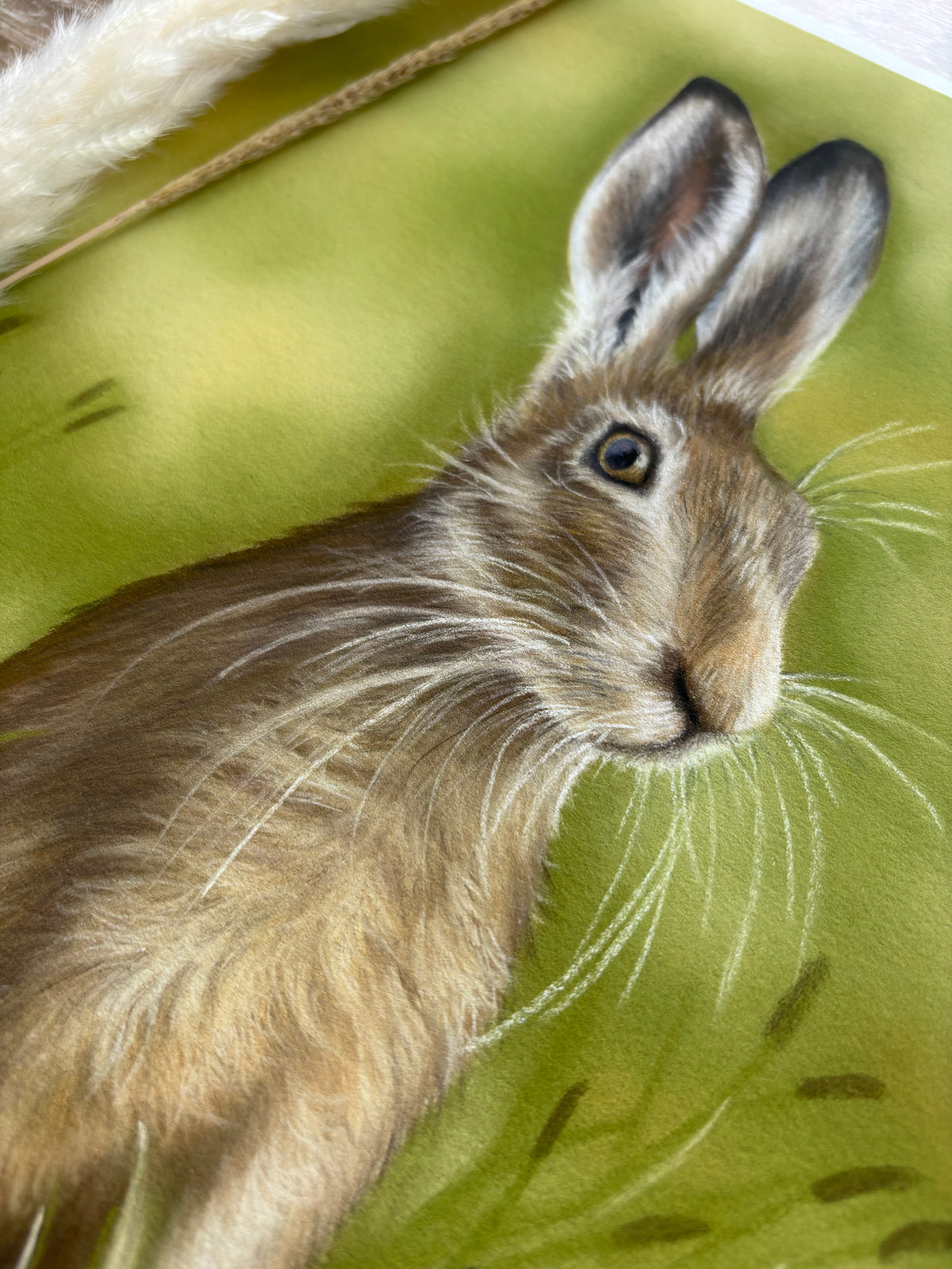 Detailed view of Hare In The Grass Fine Art Print On Paper showing lifelike fur and whiskers, ideal for fine art and nature lovers.
