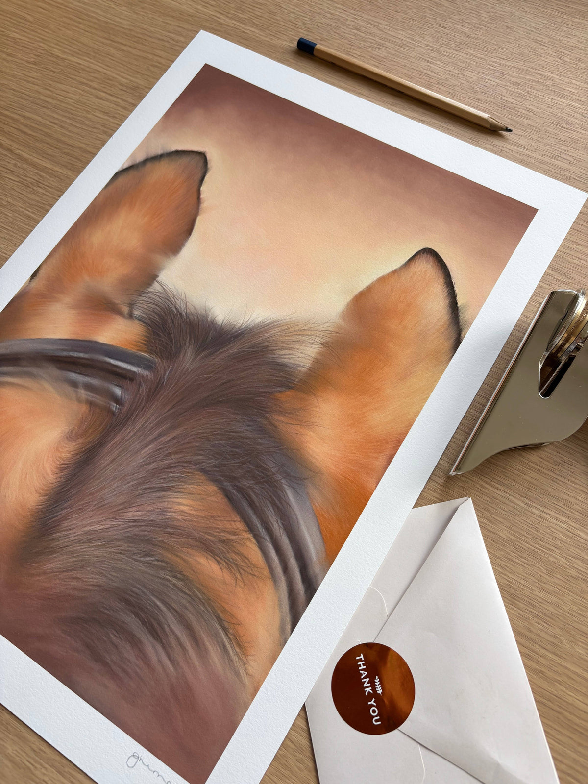 Unframed Horse Riding Equestrian Fine Art Print on a wooden desk with a pencil and envelope, featuring detailed horse ear and mane artwork.