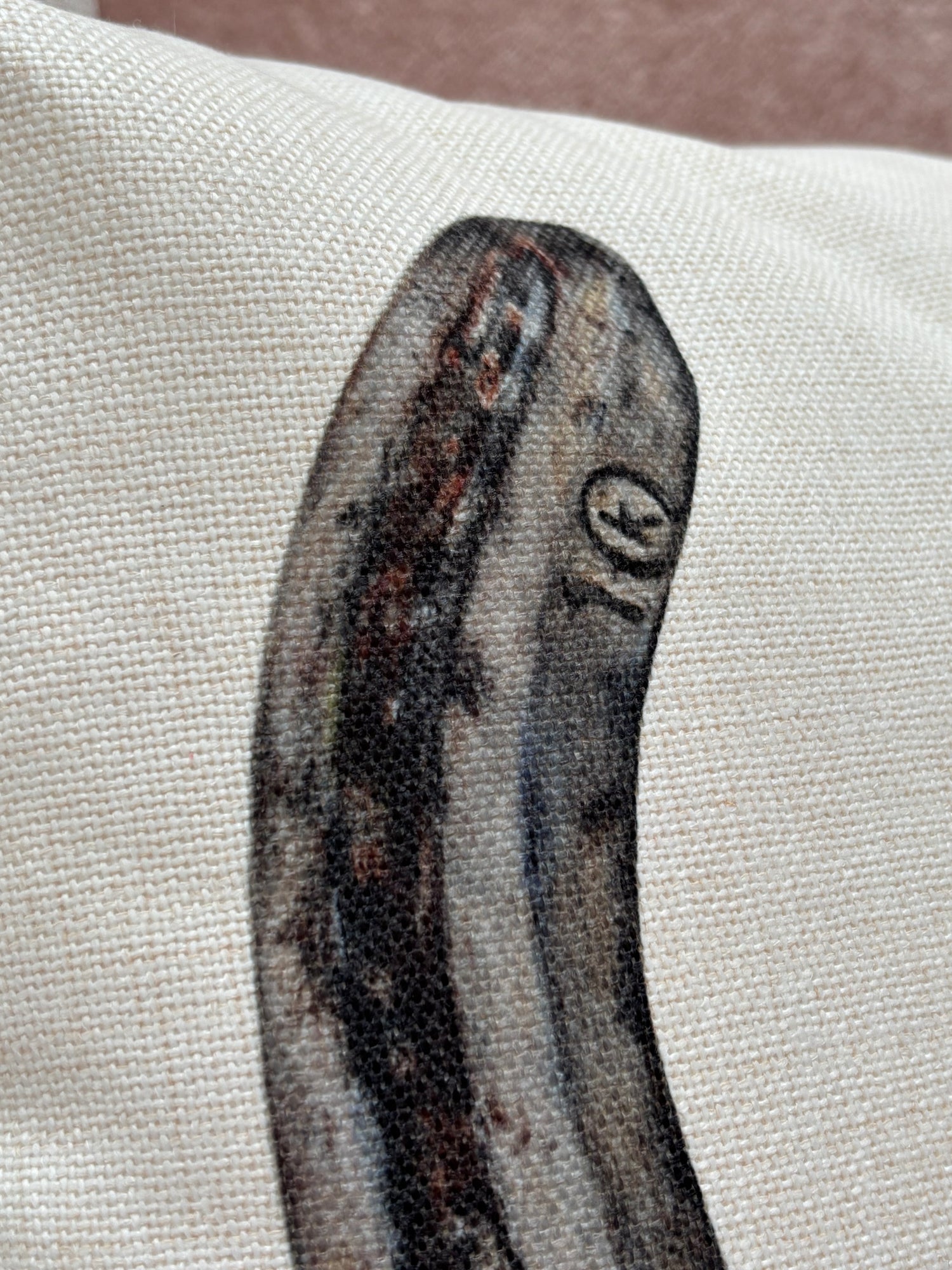 Close-up of printed horseshoe detail on Horseshoe Cushion, showcasing textured fabric and high-quality equestrian country home decor design.