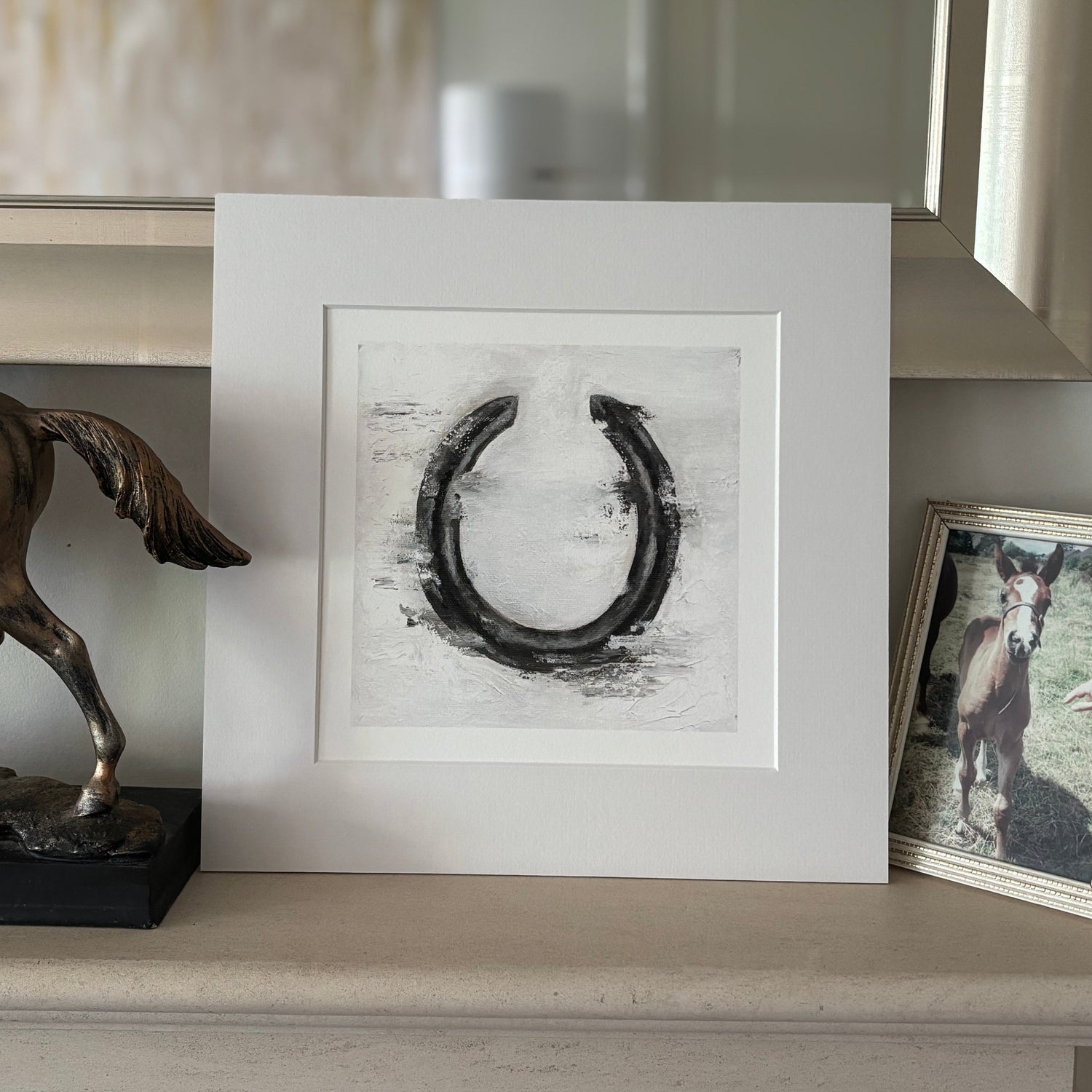 Horseshoe print on a fireplace