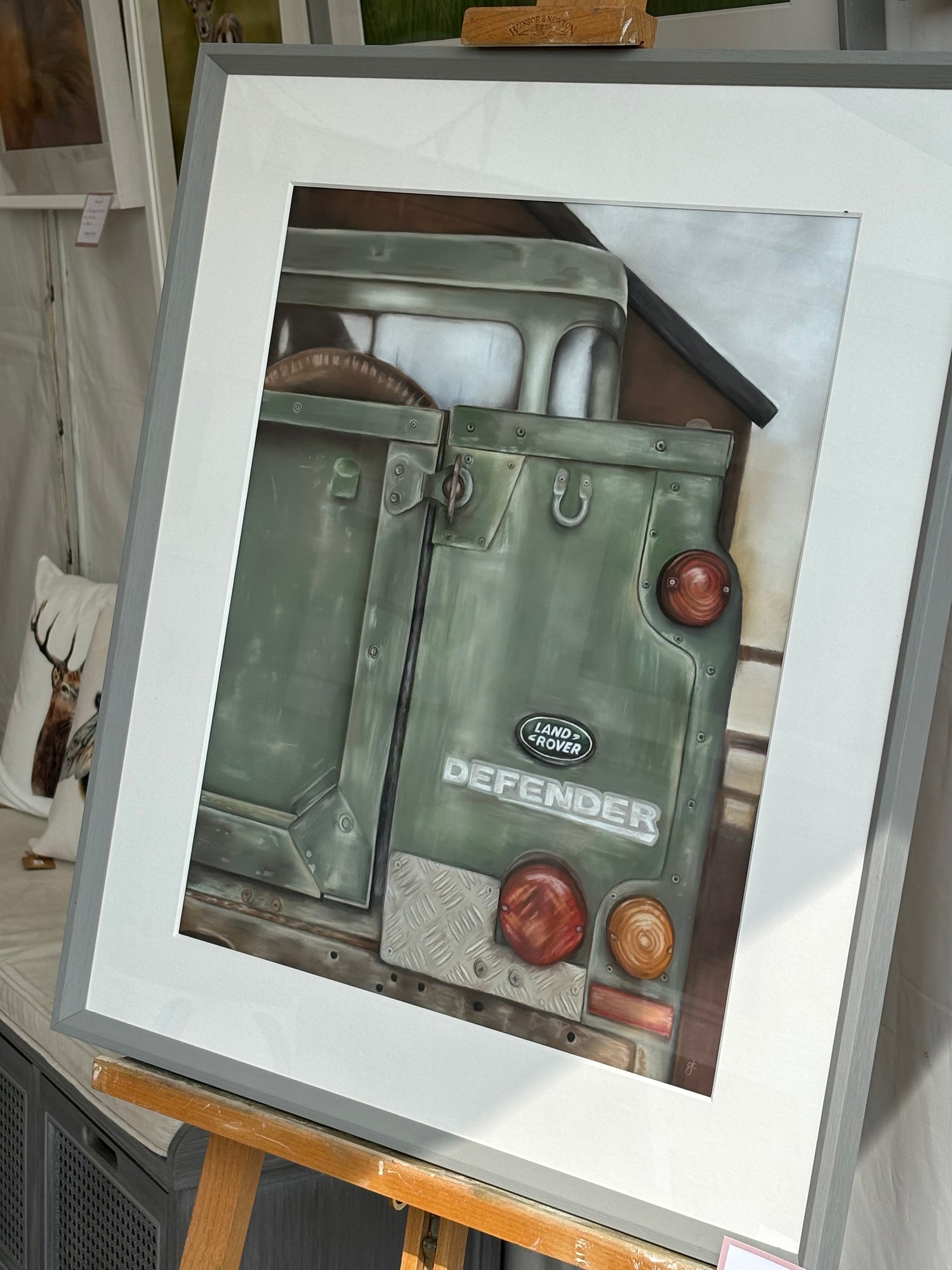 Landrover Defender original painting on easel, showcasing rustic vehicle detail for equestrian and country-themed home decor.