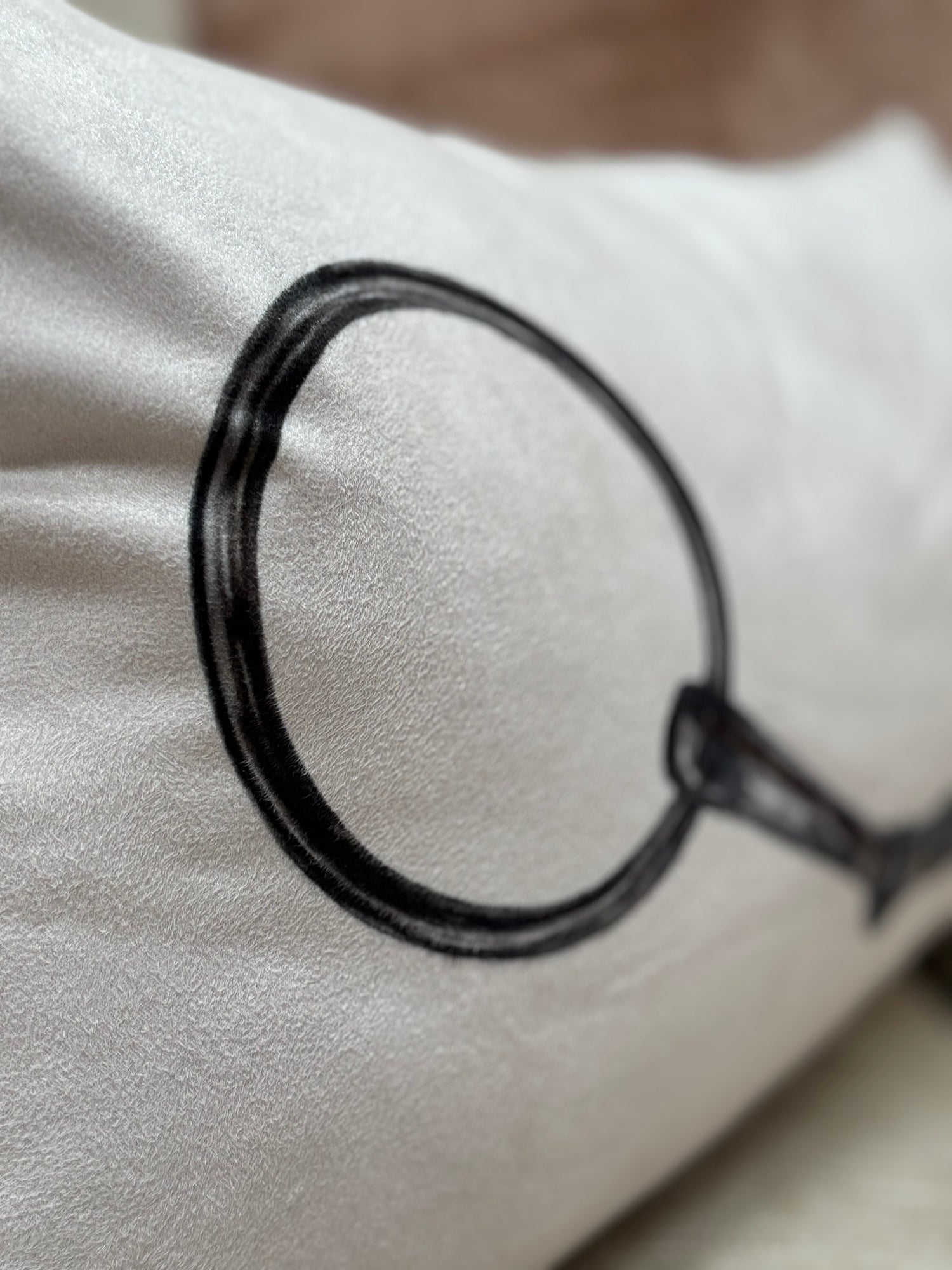 Close-up of the snaffle bit design on the Snaffle Cushion, showcasing detailed equestrian artwork for horse lovers' home decor.