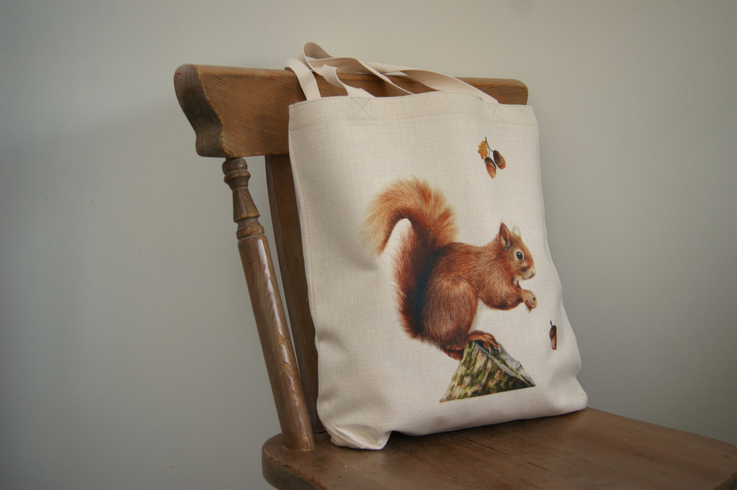 Eco-friendly squirrel tote bag made in the UK with a red squirrel illustration. Perfect gift idea for teachers and wildlife enthusiasts.