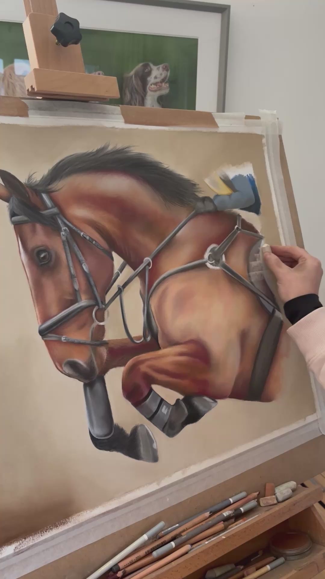 Artist painting detailed showjumping horse artwork titled 'Flying Forward,' a unique equestrian piece for country home wall decor.