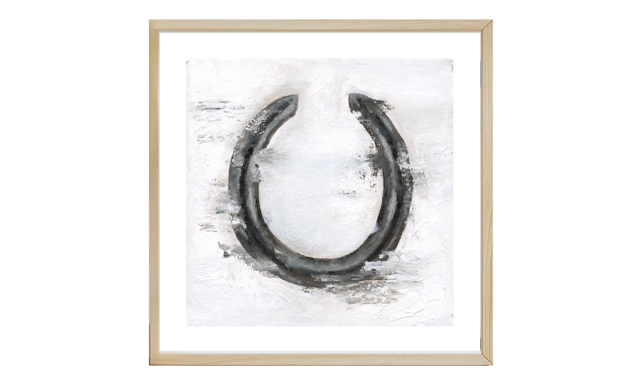Framed artwork of a horseshoe on a white background