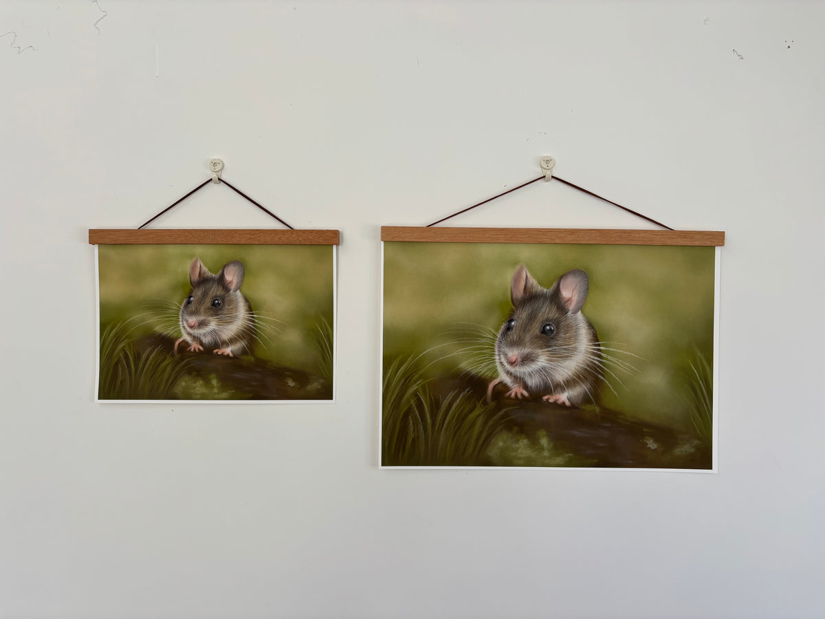 Two sizes of Field Mouse Fine Art Print On Paper hanging on a white wall with wooden hangers, perfect for British countryside-inspired interiors.