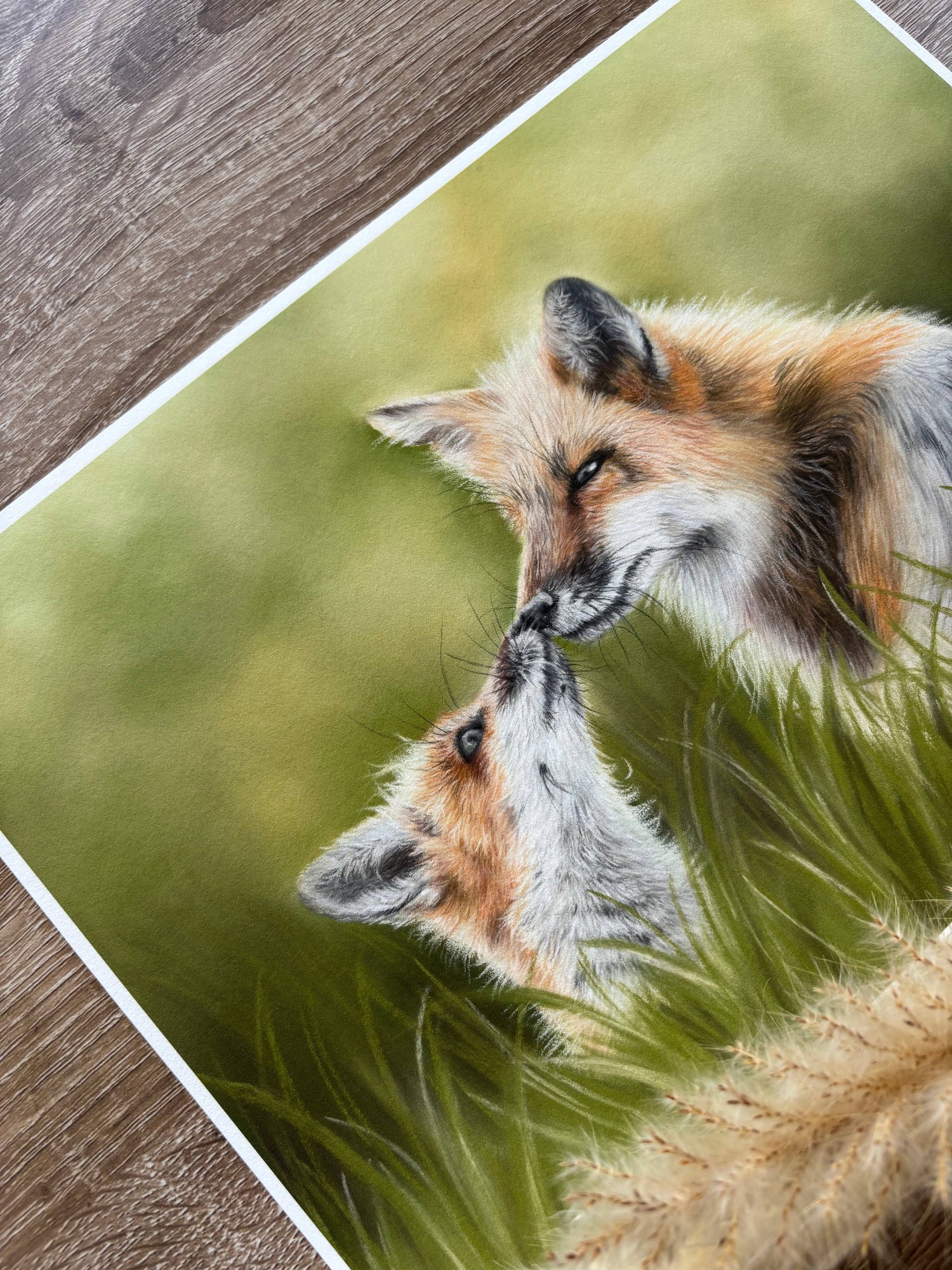 Close-up of Fox & Cub Fine Art Print On Paper showing detailed brushwork and soft green background, ideal for nature-themed decor.