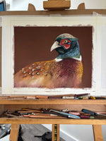 Pheasant painting 'Gerald' in progress on an easel with pastels, highlighting the creation of original country home decor wall art.