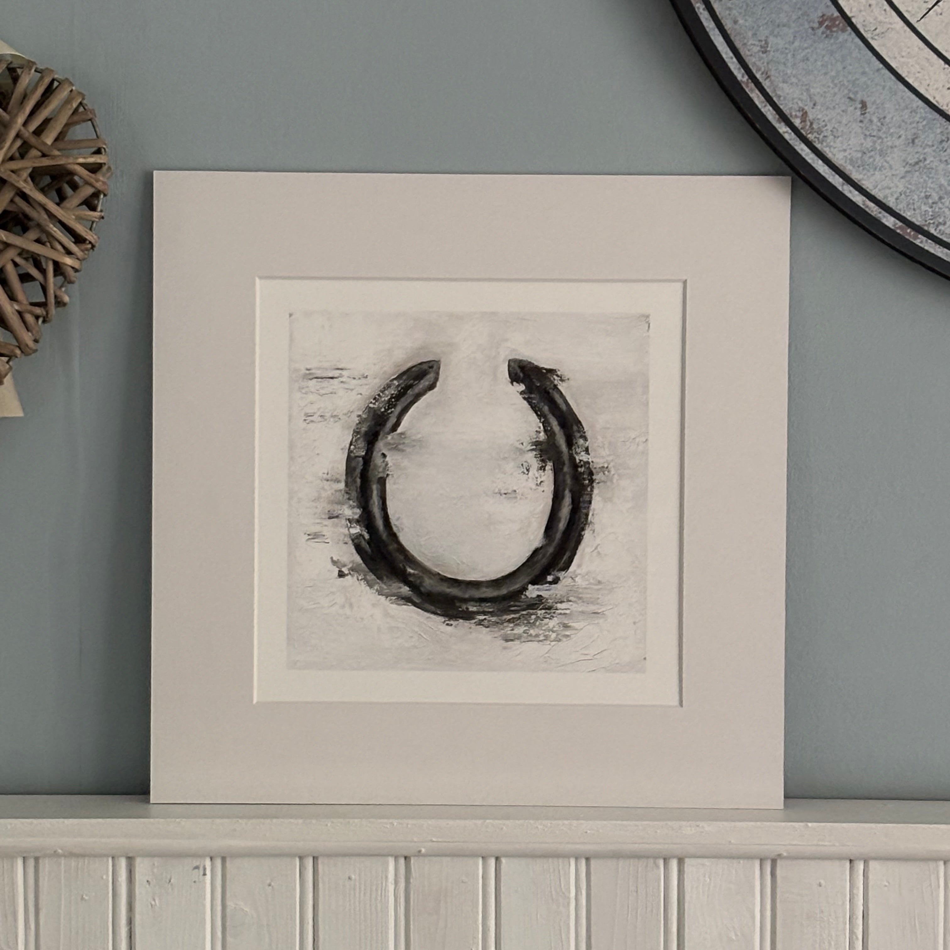 Horseshoe print in a white panelled home