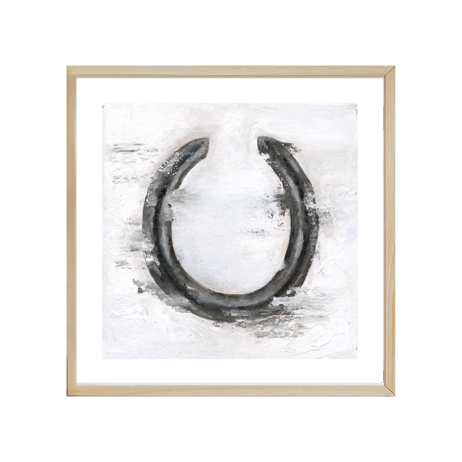 Framed artwork of a black horseshoe on a white background