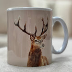 Mug with a deer design on a light surface