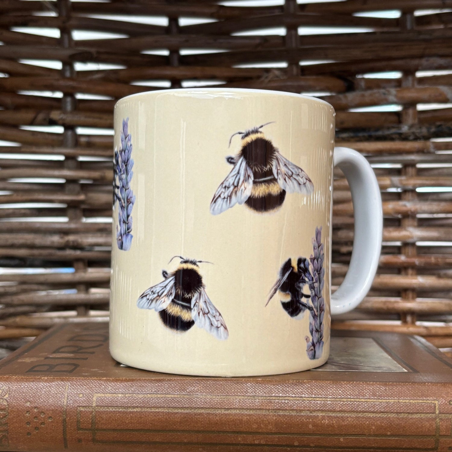 Mug with bee design on a wooden surface