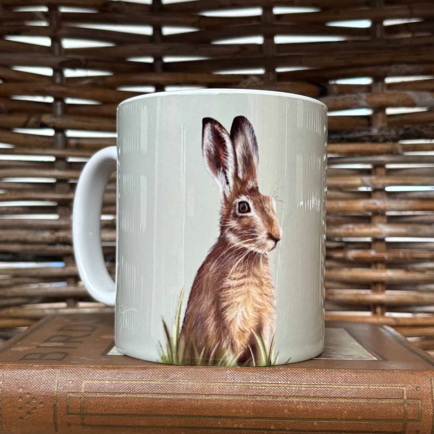 Mug with a rabbit design on a wooden surface