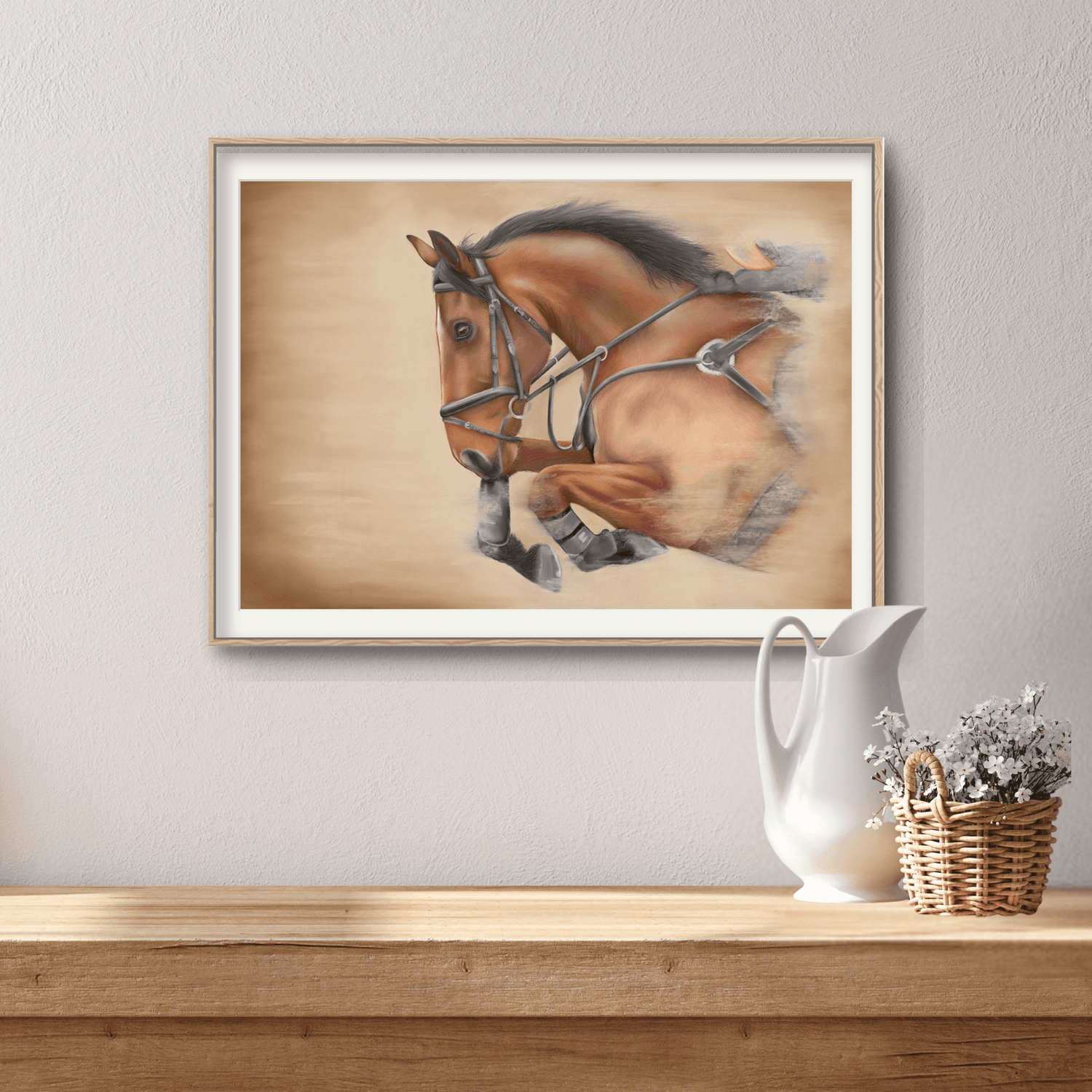 Framed Showjumping Fine Art Print On Paper showing a dynamic horse in motion, placed on a wooden surface with rustic home decor accents.