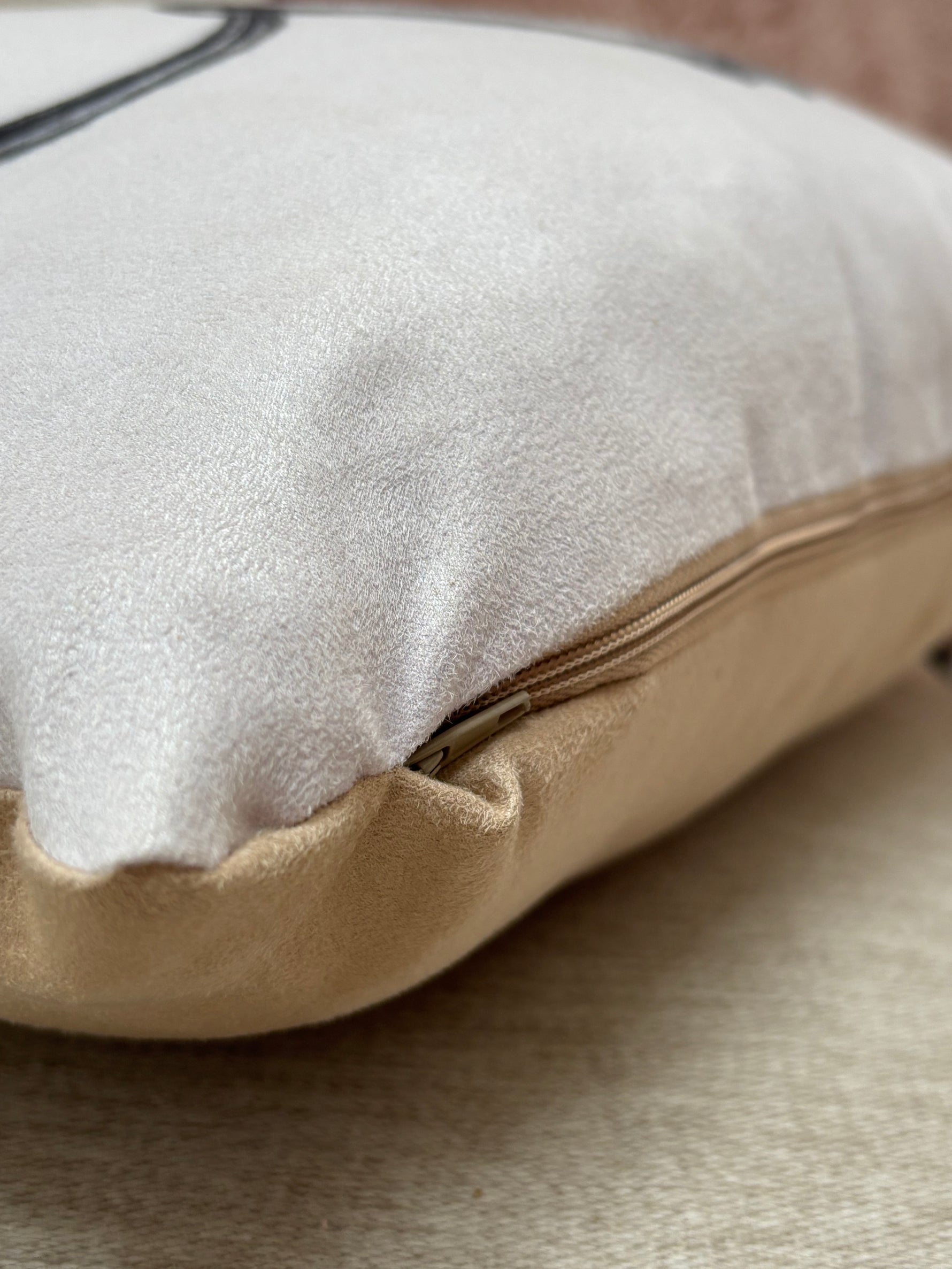 Detail of the hidden zipper on the Snaffle Cushion, highlighting quality craftsmanship in equestrian-themed throw pillows.